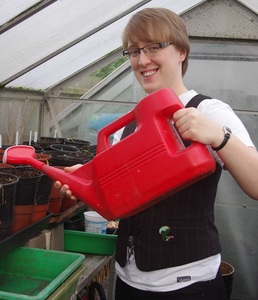 Linda with watering can